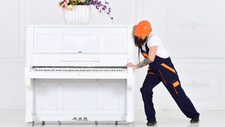 Man moving a piano