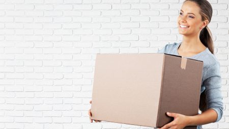 young girl with moving box