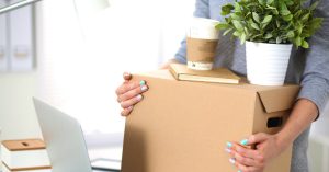 women carrying a box ready to move