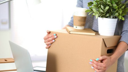 women carrying a box ready to move