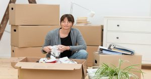 Women packing a moving box